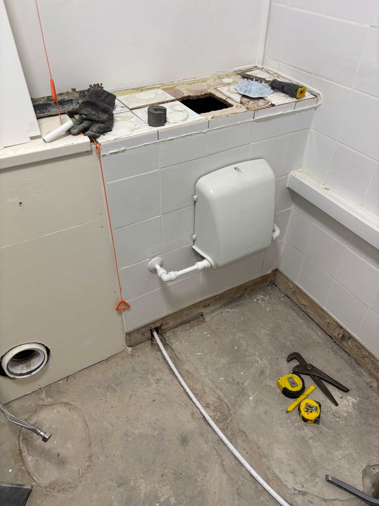 Took up existing wet room flooring -