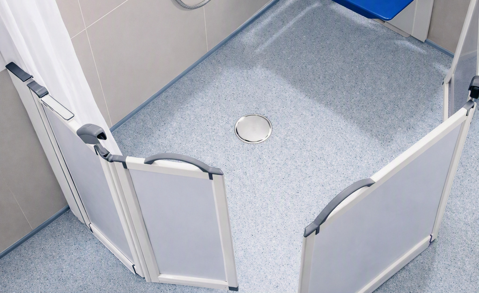 Level-access wet-room enclosure with safety vinyl flooring