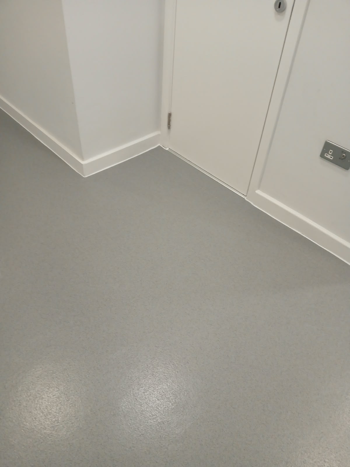 Finished Polysafe Standard Silver Birch flooring fitted around doorways and skirting
