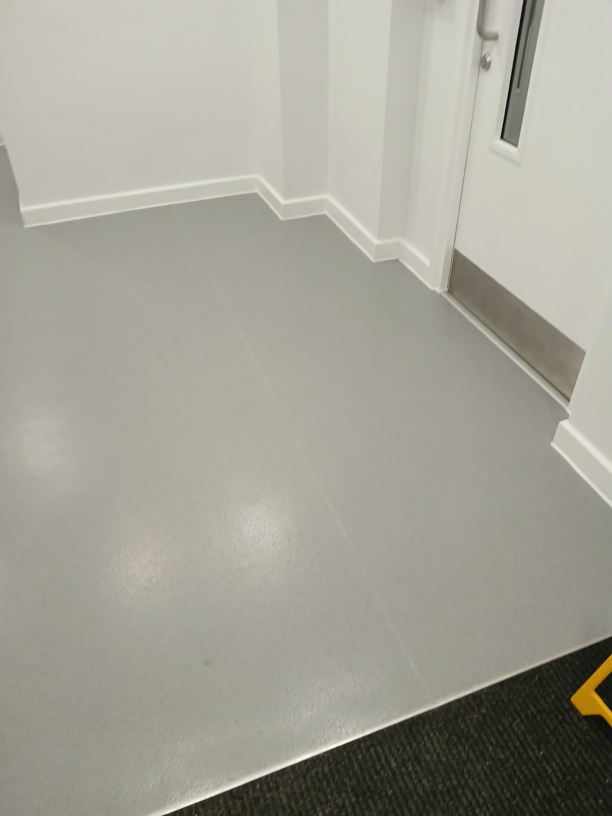 Finished Silver Birch safety flooring beside the communal entrance mat